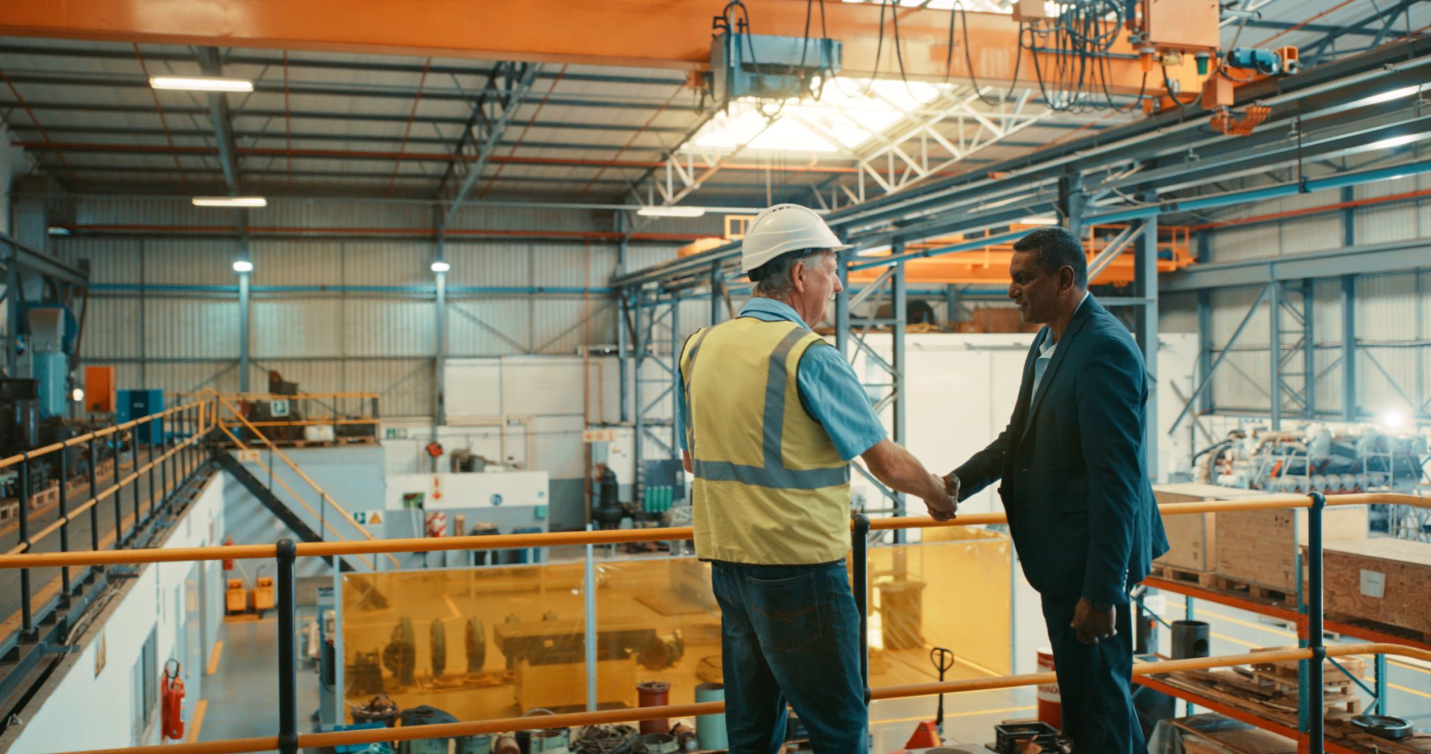 Factory handshake on elevated platform