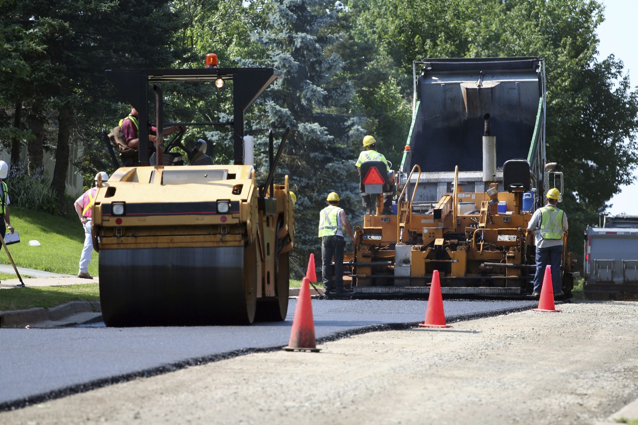 Road construction with heavy machinery and workers
